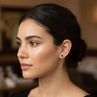 model wearing tar studs garnet 5x7mm oval