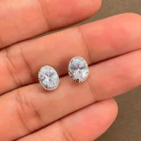 displaying tar studs cubic zirconia 5x7mm oval on hand