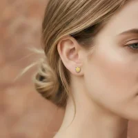 model wearing tar studs citrine 5x7mm oval
