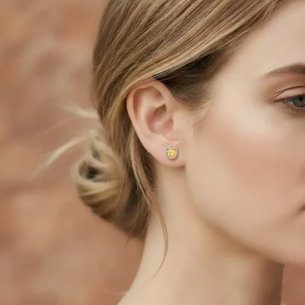 model wearing tar studs citrine 5x7mm oval