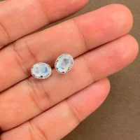 displaying tar studs rainbow moonstone 5x7mm oval on hand