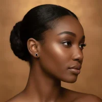 model wearing tar studs black onyx 5x7mm oval