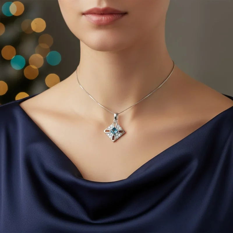 model wearing fancy square shaped london blue topaz silver pendant with cubic zirconia