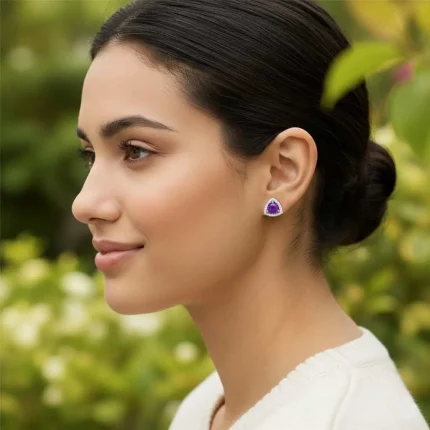 model wearing silver studs triangular shaped with 6mm round Amethyst and cubic zirconia