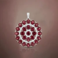 beautifully representing big silver round pendant with garnet and cubic zirconia