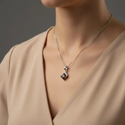 model wearing square shaped smoky quartz with cubic zirconia silver pendant