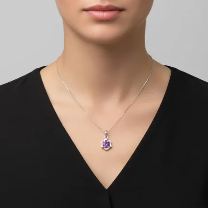 model wearing 5mm round amethyst with cubic zirconia flower shaped silver pendant