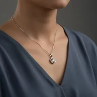 model wearing 5mm round rainbow moonstone with cubic zirconia flower shaped silver pendant
