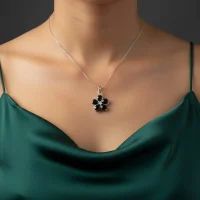 model wearing black onyx silver pendant with cubic zirconia
