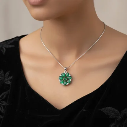 model wearing 5x7 pear shaped green onyx with cubic zirconia flower shaped silver pendant