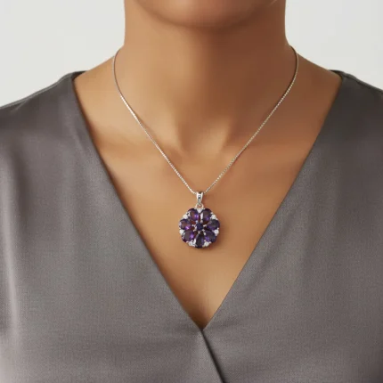 model wearing 5x7 pear shaped amethyst with cubic zirconia flower shaped silver pendant