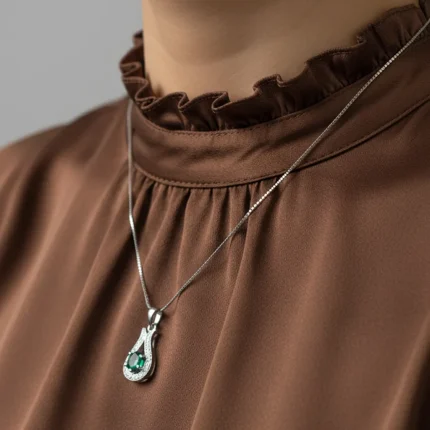 model wearing 6mm round green onyx with cubic zirconia silver pendant