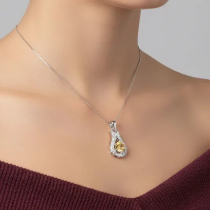 model wearing 6mm round citrine with cubic zirconia silver pendant