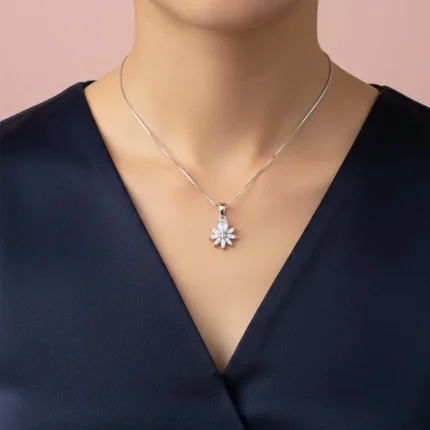 model wearing 5x7 mm pear shaped rainbow moonstone with cubic zirconia silver flower pendant