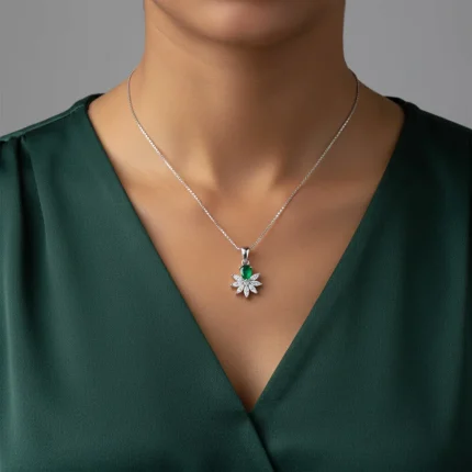 model wearing 5x7 mm pear shaped green onyx with cubic zirconia silver flower pendant