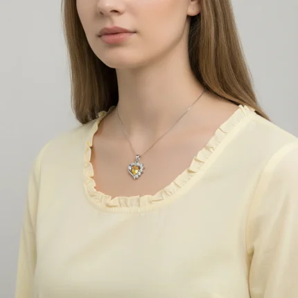 model wearing 5x7 mm pear shaped citrine with cubic zirconia silver heart shaped pendant