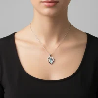 model wearing 5x7 mm pear shaped blue topaz with cubic zirconia silver heart shaped pendant
