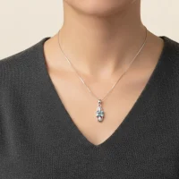 model wearing 5x7mm octagon shaped blue topaz with cubic zirconia silver pendant