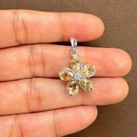 beautifully portraying the citrine silver pendant on hands