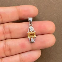 5x7mm octagon shaped citrine with cubic zirconia silver pendant displaying on hand