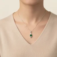 model wearing 5x7mm octagon shaped green onyx with cubic zirconia silver pendant