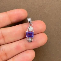 5x7mm octagon shaped amethyst with cubic zirconia silver pendant displaying on hand
