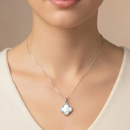 model wearing silver pendant clover shaped mother of pearl