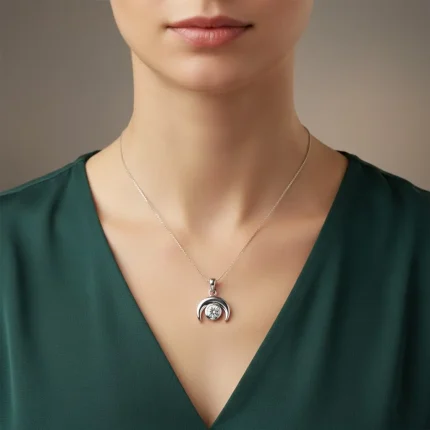 model wearing Moon shaped silver pendant with cubic zirconia