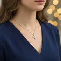 model wearing Star shaped silver pendant with cubic zirconia