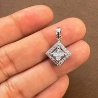 square shaped 5mm cluster silver pendant with cubic zirconia displayed on hand