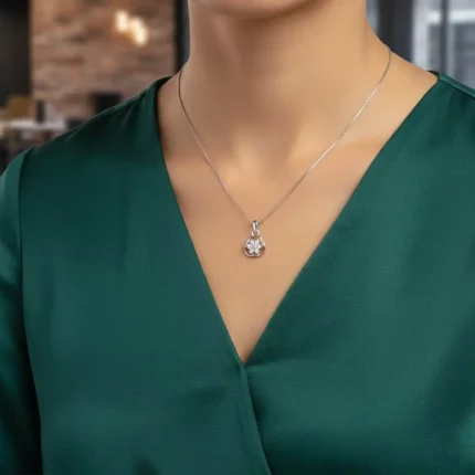 model wearing flower shaped seven piece cubic zirconia silver pendant