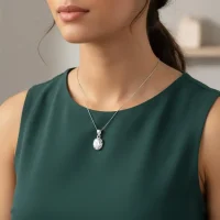 model wearing silver pendant with 7x9mm oval cubic zirconia in tar setting