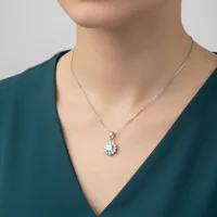 model wearing Silver pendant with 5mm round cubic zirconia in cluster gidha setting
