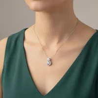 model wearing silver pendant with 5mm round cubic zirconia