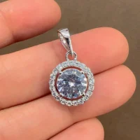 silver pendant cluster 8mm round cubic zirconia displayed on hand
