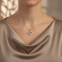 model wearing Heart shaped hollow silver pendant with cubic zirconia
