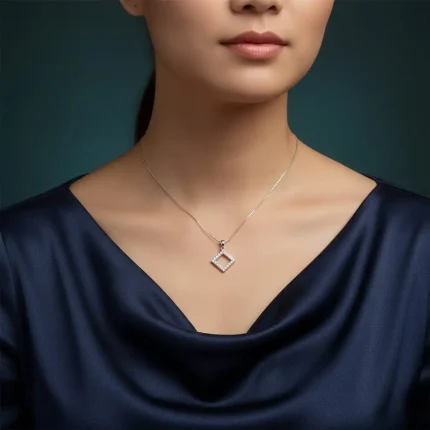 model wearing Square shaped hollow silver pendant with cubic zirconia