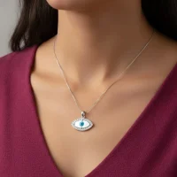 model wearing silver pendant with 7x14mm eye shaped cluster evil eye