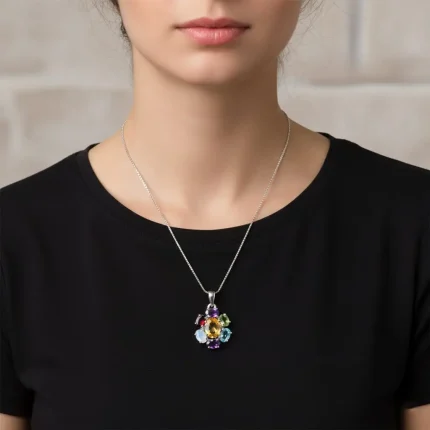 model wearing silver pendant with 7x9 mm & 6x4 mm oval multi gemstone