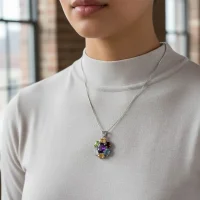 model wearing silver pendant with 7x9 mm & 6x4 mm oval multi gemstone