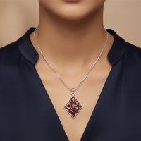 model wearing silver pendant rhombus shaped with different shape garnet