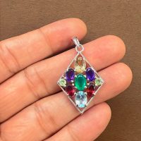 silver pendant rhombus shaped with different shape multi gemstone displayed on hand