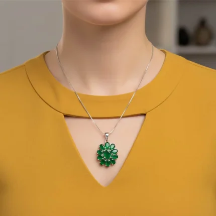 model wearing silver pendant flower shaped with green onyx