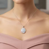 model wearing silver pendant flower shaped with rainbow moonstone