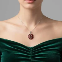 model wearing silver pendant flower shaped with garnet