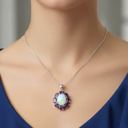 model wearing silver pendant with 10x12 mm oval opal and 6x4 mm amethyst gemstone