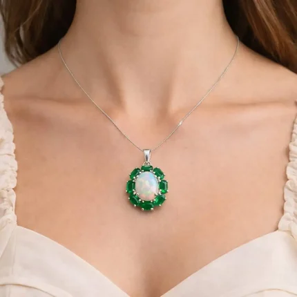 model wearing silver pendant with 10x12 mm oval opal and 6x4 mm green onyx gemstone