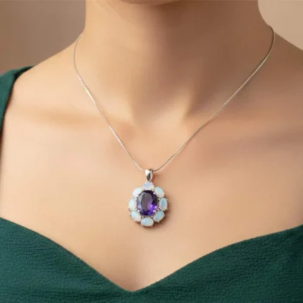 model wearing silver pendant with 10x12 mm oval amethyst and 6x4 mm rainbow moonstone gemstone