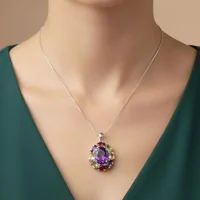 model wearing silver pendant with 10x12 mm oval amethyst and 6x4 mm multi gemstone