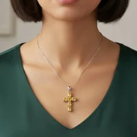 model wearing silver pendant cross design with 4x6mm oval citrine